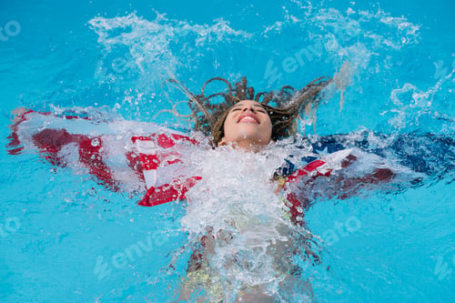 Preview: Woman inside the pool enjoying happy with American flag