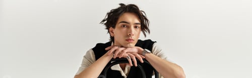 Preview: Handsome young man showcasing stylish fashion in trendy studio setting