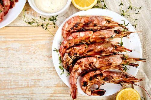 Preview: Grilled big tiger shrimps prawns on white plate