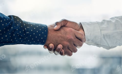 Preview: Im glad to have you on board. Shot of two colleagues shaking hands in the office.