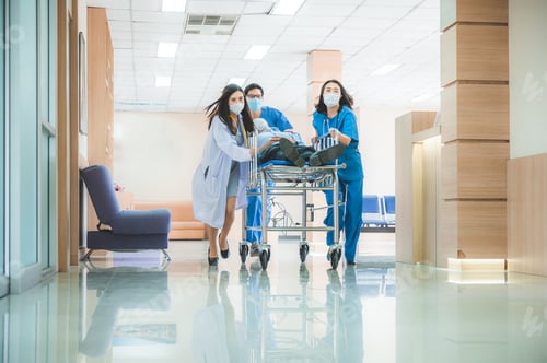 Preview: Emergency department, doctors and surgeons team move seriously injured patient lying