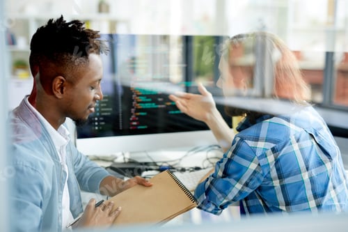 Preview: Multiethnic programmers working on new web site