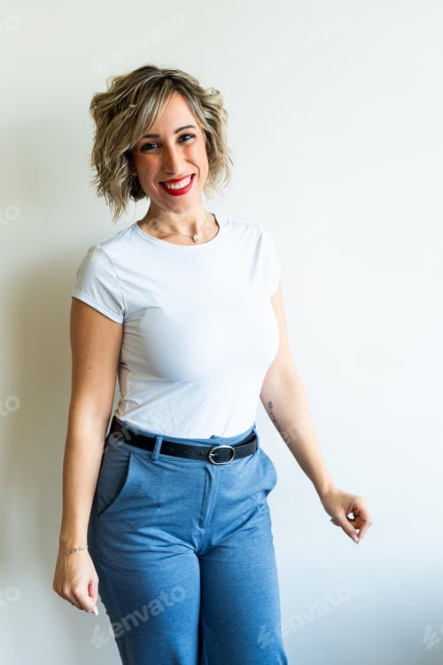 Preview: Young blonde businesswoman smiling wearing casual clothes on white background
