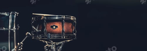 Preview: Snare drum on a dark background isolated with space for a text.