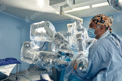 Preview: Surgeon in Operating Room with Robotic Surgical System