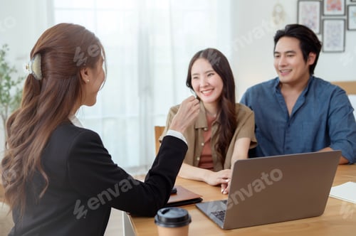 Preview: Couple Sharing a Joyful Moment With a Consultant in a Bright Office