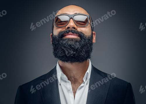 Preview: Portrait of bearded male in a suit and sunglasses.