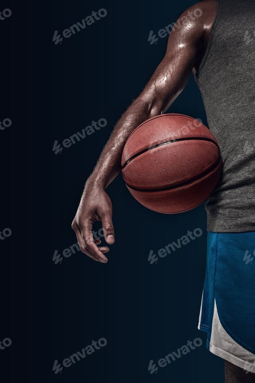 Preview: The hands of a basketball player with ball