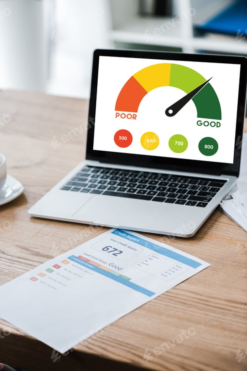 Preview: laptop with speed meter on screen near paper with credit report on desk