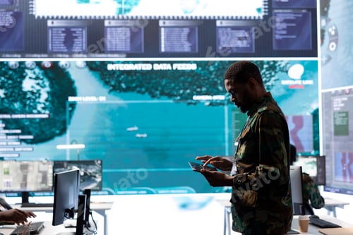 Preview: Military personnel in a base of operations using advanced computers