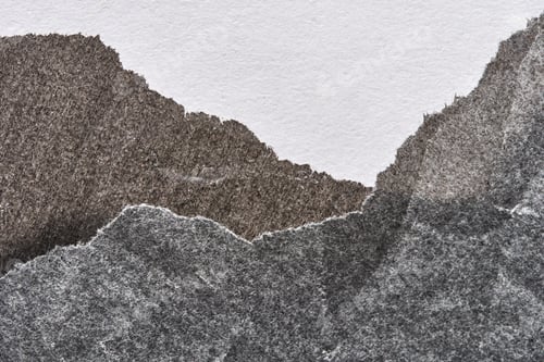 Preview: Abstract torn paper layers creating a textured landscape in monochrome hues on white background
