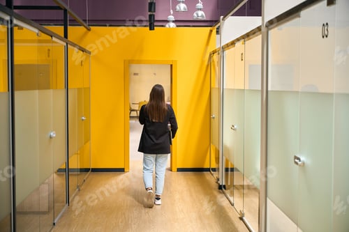Preview: Woman enters the office from the corridor