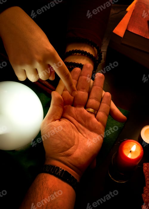 Preview: Pythoness reading the future in the hand of a man.