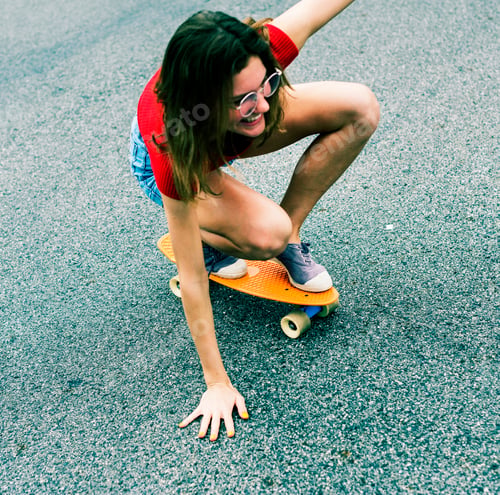 Preview: Closeup of a Caucasian woman skateboarding
