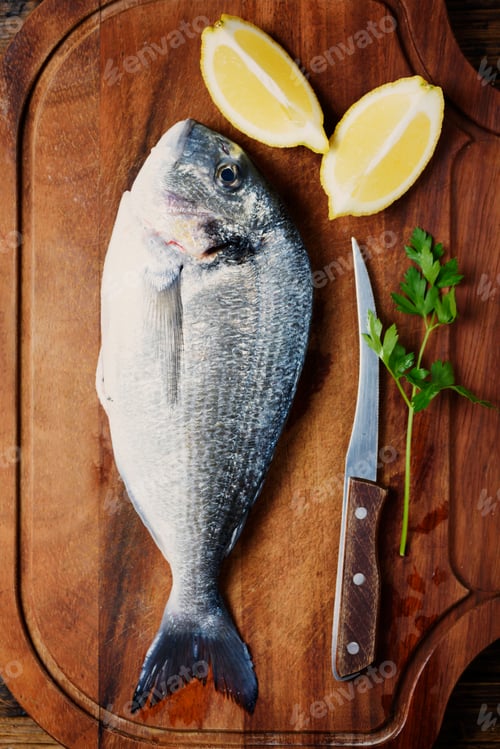Preview: Healthy fresh raw fish on the wooden board