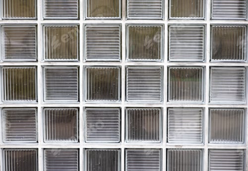 Preview: Old wall made of glass blocks. Glass blocks background.