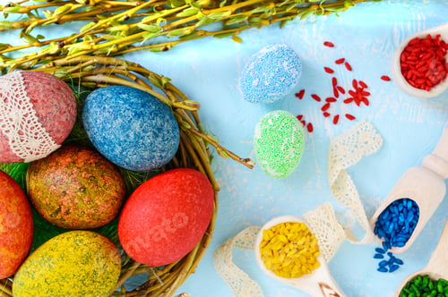 Preview: Colorful painted eggs in a nest of twigs of willow