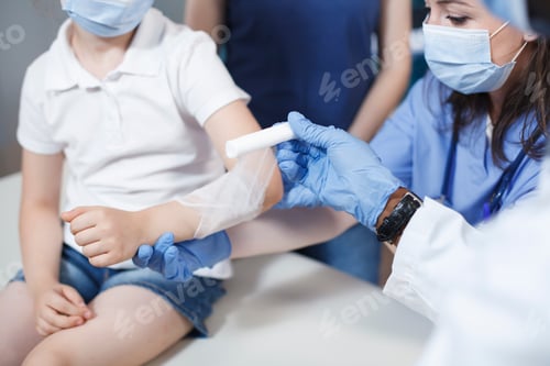 Preview: Arm of patient being treated by doctors