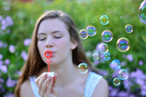 Preview: Girl blowing bubbles