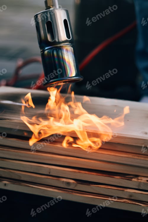 Preview: Blow Torch Applying Intense Heat to Wood Planks