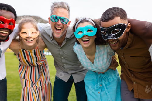 Preview: Portrait of happy diverse friends embracing during wedding