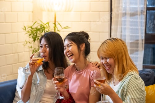 Preview: group of asian woman friend celebrate new year party at night at home