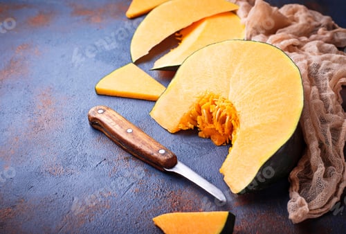 Preview: Raw chopped pumpkin on concrete background