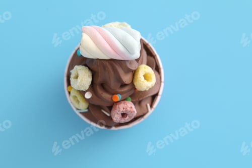 Preview: Chocolate Cupcake Isolated In Blue Background