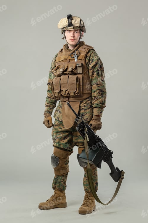 Preview: Soldier stands with rifle in uniform at military base during day