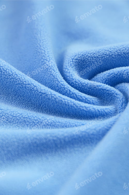 Preview: The blanket of furry blue fleece fabric. A background of light blue soft plush fleece