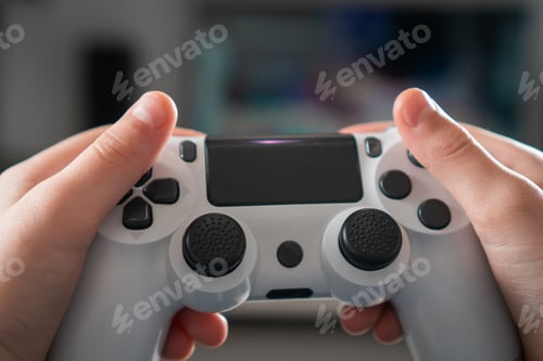 Preview: Male hands hold modified plastic joystick closeup, selective focus. Person play videogames
