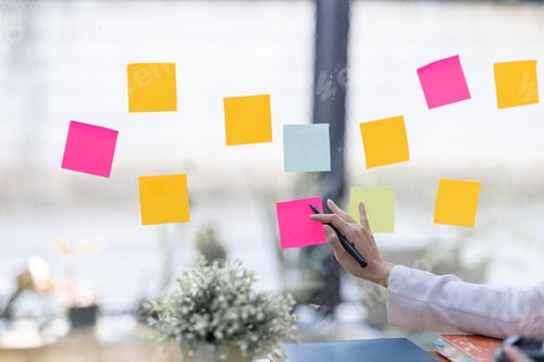 Preview: Business female employee with many conflicting priorities arranging sticky notes commenting and brai