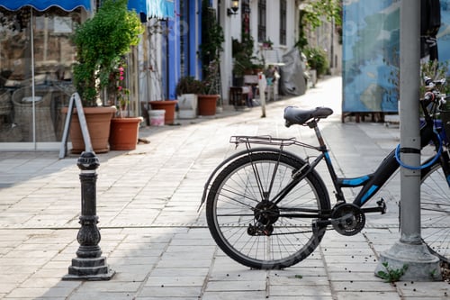 Preview: Bicycle in sunlight on the narrow tourist street of Bodrum, Turkey.