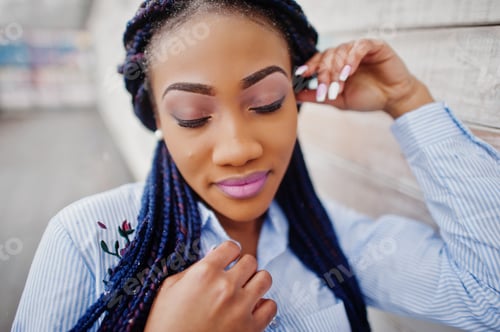 Preview: Stylish african american girl with dreads