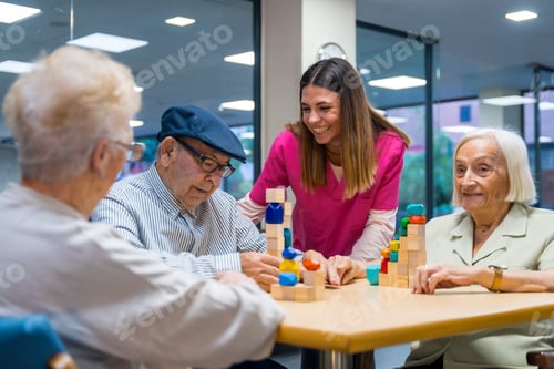 Preview: Nurse encouraging elder people playing skill games in a nursing home