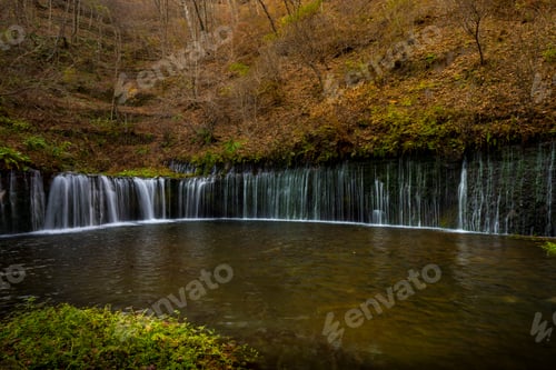 Preview: Autumn Cascade: Tranquil Waterfall in a Forest Setting