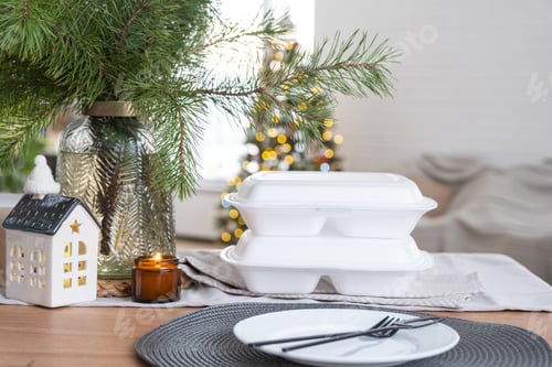 Preview: Food delivery service containers on table in white kitchen, festively served for celebration
