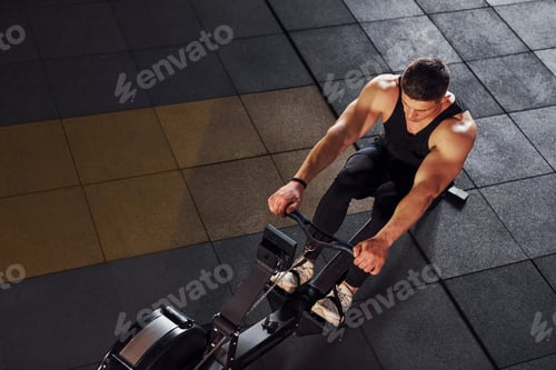 Preview: Strong man in sportive clothes have workout day in the gym