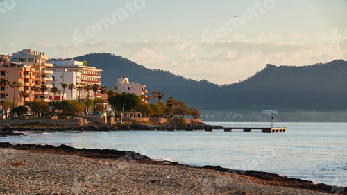 Preview: Scenic view of the rocky shoreline of a tranquil beach in Cala Rajada, Mallorca