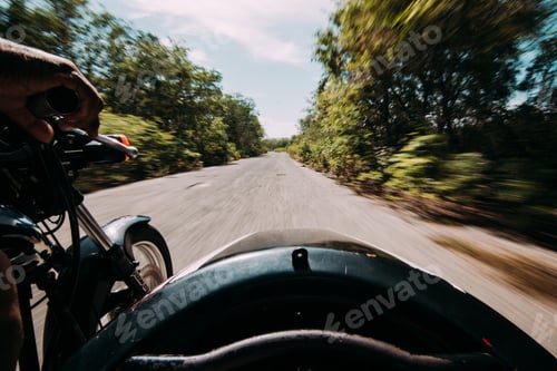 Preview: Driving motorcycle on rural green road