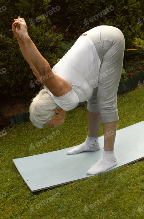 Preview: an elderly gray-haired woman does therapeutic exercises to strengthen and stretch the shoulder joint