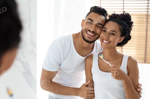 Preview: Happy Morning. Portrait Of Joyful Young Arab Couple Brushing Teeth In Bathroom