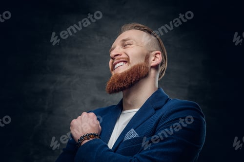 Preview: Redhead hipster male dressed in a blue jacket.