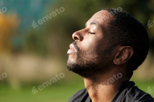 Preview: Serene man breathing fresh air in nature, enjoying peace and tranquility