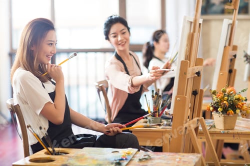 Preview: Young women painting in studio