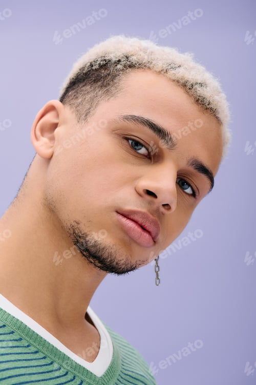 Preview: Young african american man showcasing stylish fashion against a vibrant purple backdrop