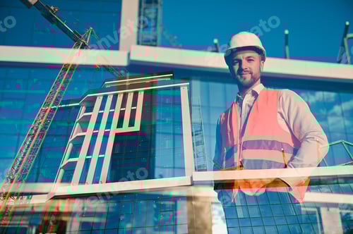 Preview: Engineer next to building cranes. Concept - large construction project.