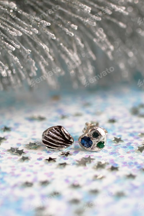 Preview: Handmade stylish silver earrings with gemstones on white Christmas glitter background.