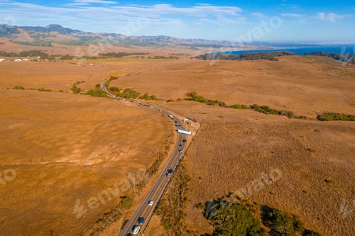 Preview: Aerial shot of the road traffic among a beautiful nature at daytime