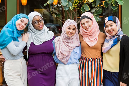 Preview: Group of islamic friends arms around and smiling together